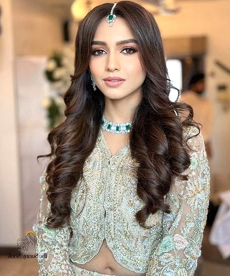 16 Open Hairstyles For Lehenga for When You Need a Fresh Change 2 Loose Curls With a Middle Part