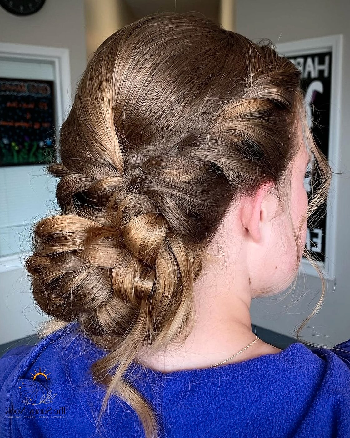 23 Updo Hairstyles For Prom Everyone Is Pinning Right Now 20 Low Braided Bun with Baby's Breath
