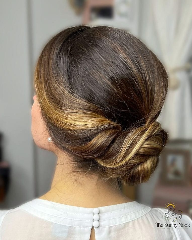11 Messy Bun Hairstyles Indian Saree to Show Your Stylist ASAP 3 Low Messy Bun with a Middle Part