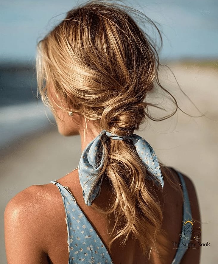 22 Easy Beach Hairstyles That Are Actually Easy to DIY 12 Low Ponytail with a Wrap