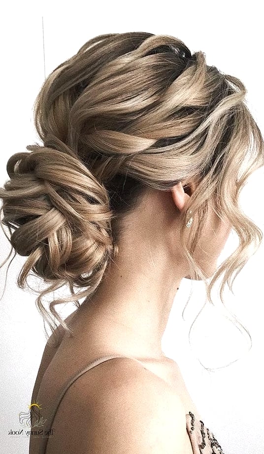 22 Classy Updo Hairstyles That Prove This Trend Is Here to Stay 9 Messy Low Ponytail Bun
