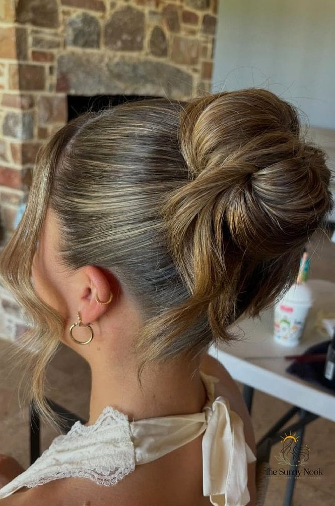 22 Classy Updo Hairstyles That Prove This Trend Is Here to Stay 20 Polished Low Chignon with Sleek Center Part