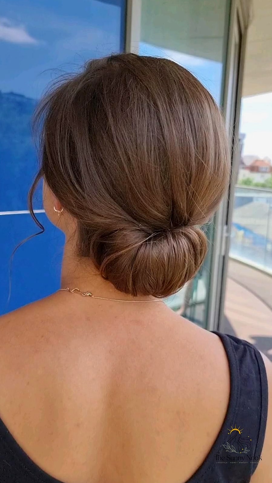 Sleek Low Bun with Face-Framing Pieces