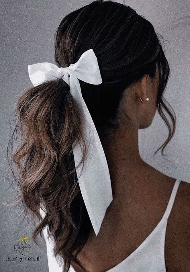 25 Cute Hairstyles With A Bow Everyone Is Pinning Right Now 3 Sleek Low Bow Ponytail