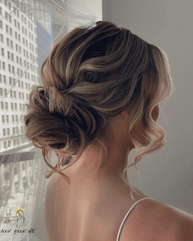 7 Short Updo Hairstyles Easy Inspo That's Giving Us Everything 6 Sleek Low Bun with Face-Framing Pieces