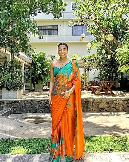 20 Indian Wedding Guest Hairstyles Inspo That's Giving Us Everything 12 Sleek Middle-Part Straight Hair with a Deep Side Bun