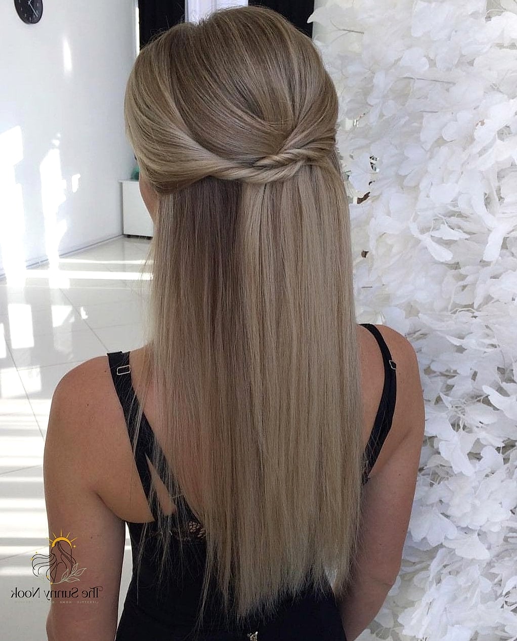 22 Cute Down Hairstyles Perfect for Your Next Salon Appointment 3 Sleek Straight Hair with a Middle Part