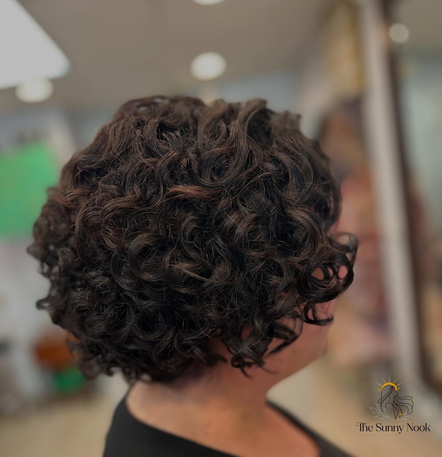 27 Hairstyles For Curly Hair Short Perfect for Your Next Salon Appointment 26 Textured Bob with Tight Curls and Subtle Highlights