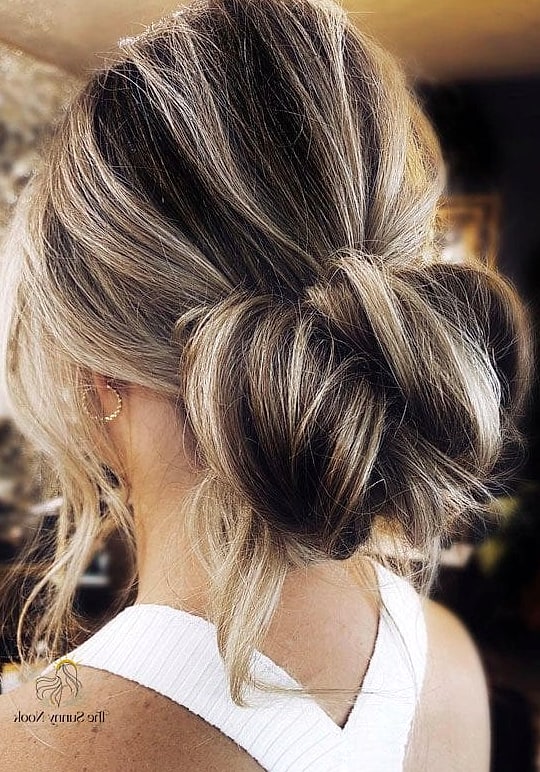 22 Classy Updo Hairstyles That Prove This Trend Is Here to Stay 3 Textured Low Bun with Face-Framing Pieces