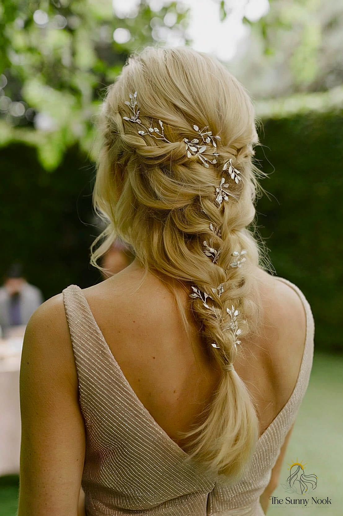 22 Elegant Hairstyles For Wedding Guest That Prove This Trend Is Here to Stay 15 Textured Low Bun with Braided Wrap