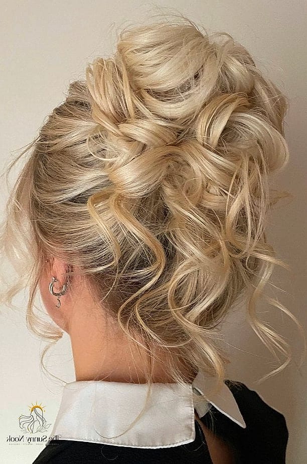 18 Messy Updo Hairstyles That Belong on Your Inspiration Board 19 Undone Top Knot with Face-Framing Layers