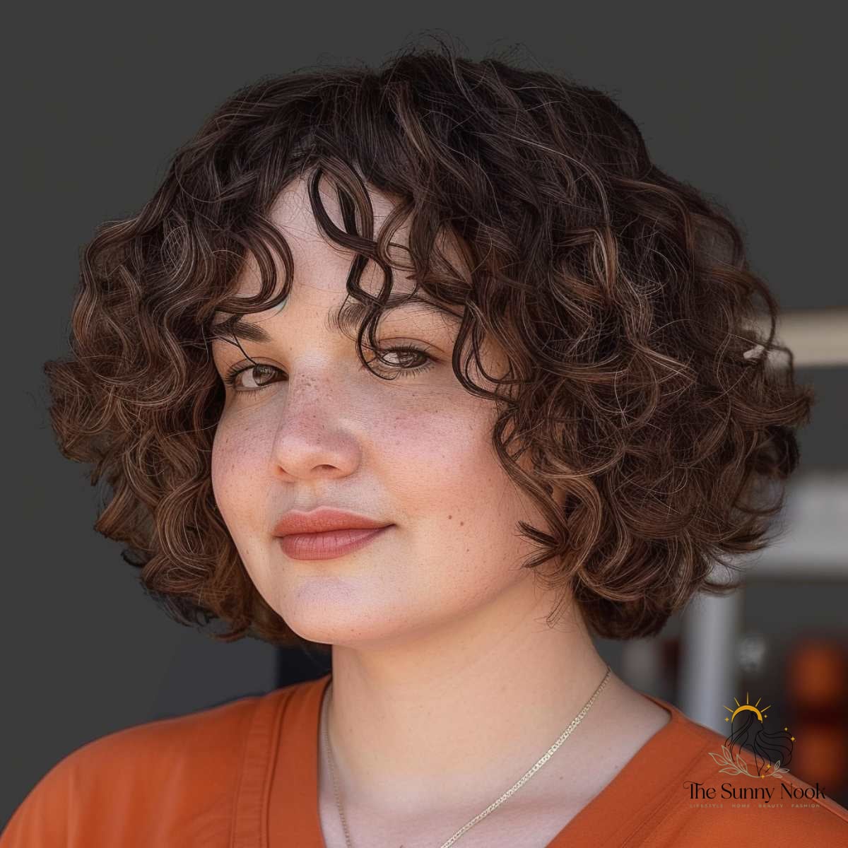 27 Hairstyles For Curly Hair Short Perfect for Your Next Salon Appointment 8 Voluminous Frizzy Chin-Length Curls