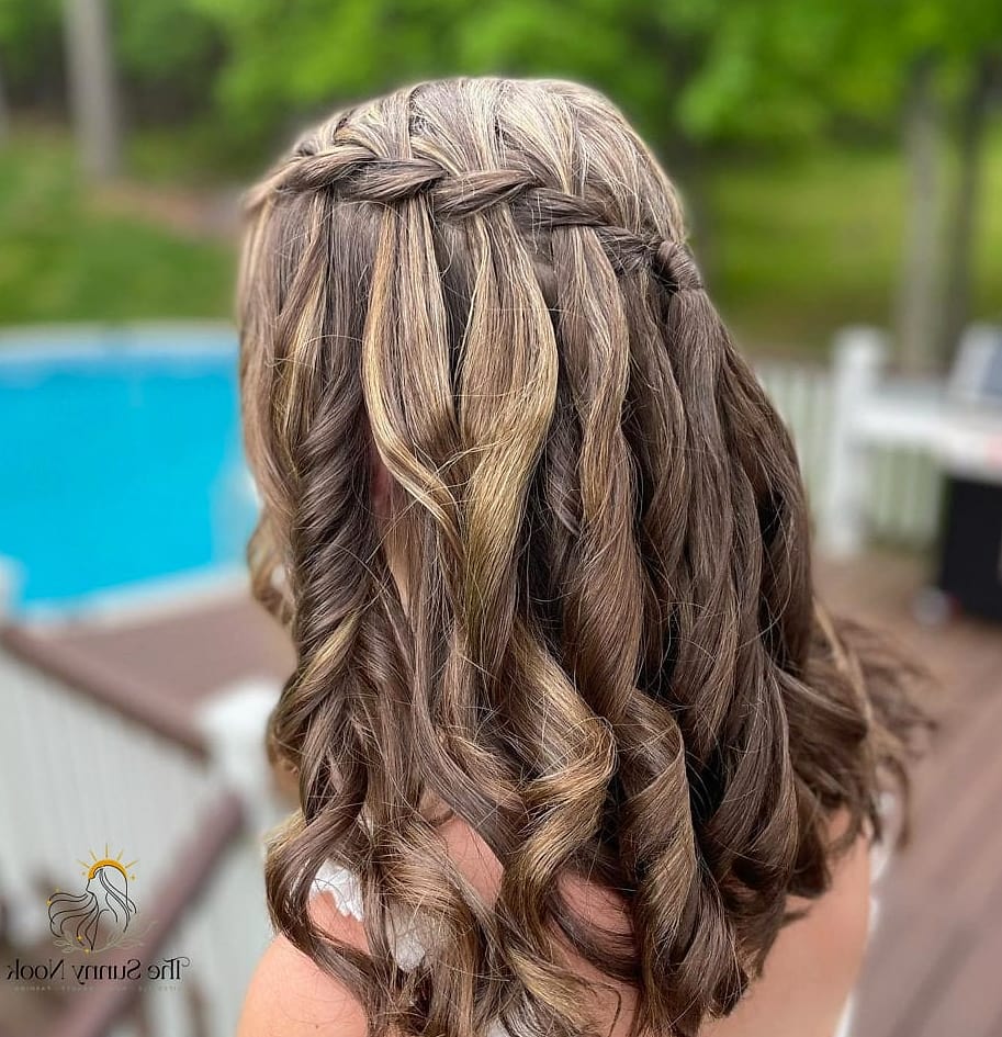 23 Updo Hairstyles For Prom Everyone Is Pinning Right Now 8 Waterfall Braid into a Loose Updo